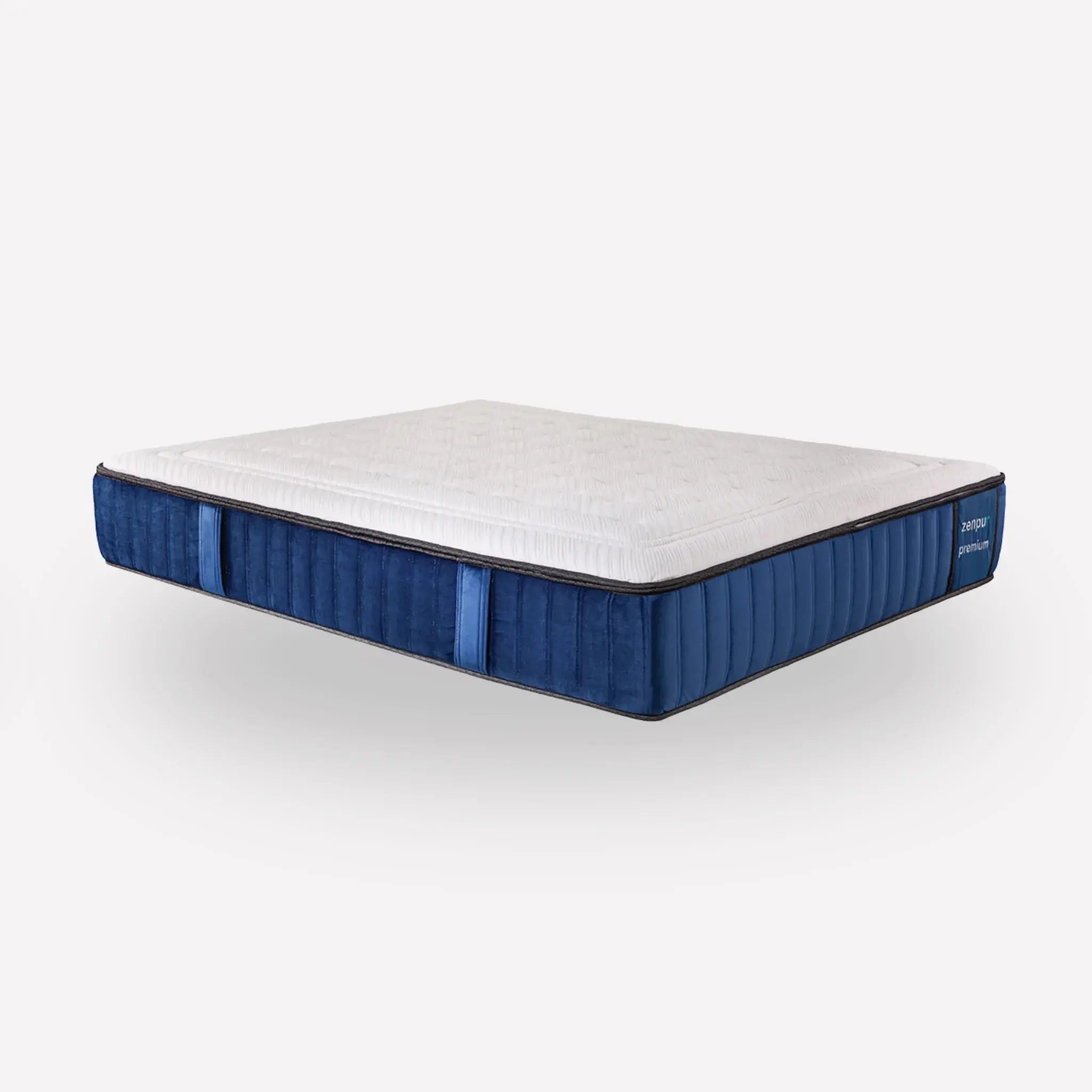 Main pressant dans un bloc de mousse à mémoire de forme Zenpur pour montrer l'effet viscoélastique.